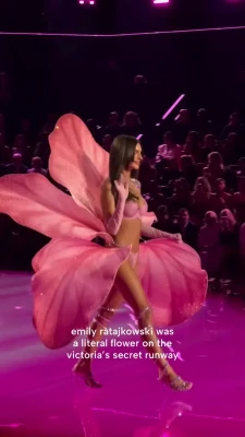 emrata - I know my ass is extremely mesmerizing in this shiny one piece.